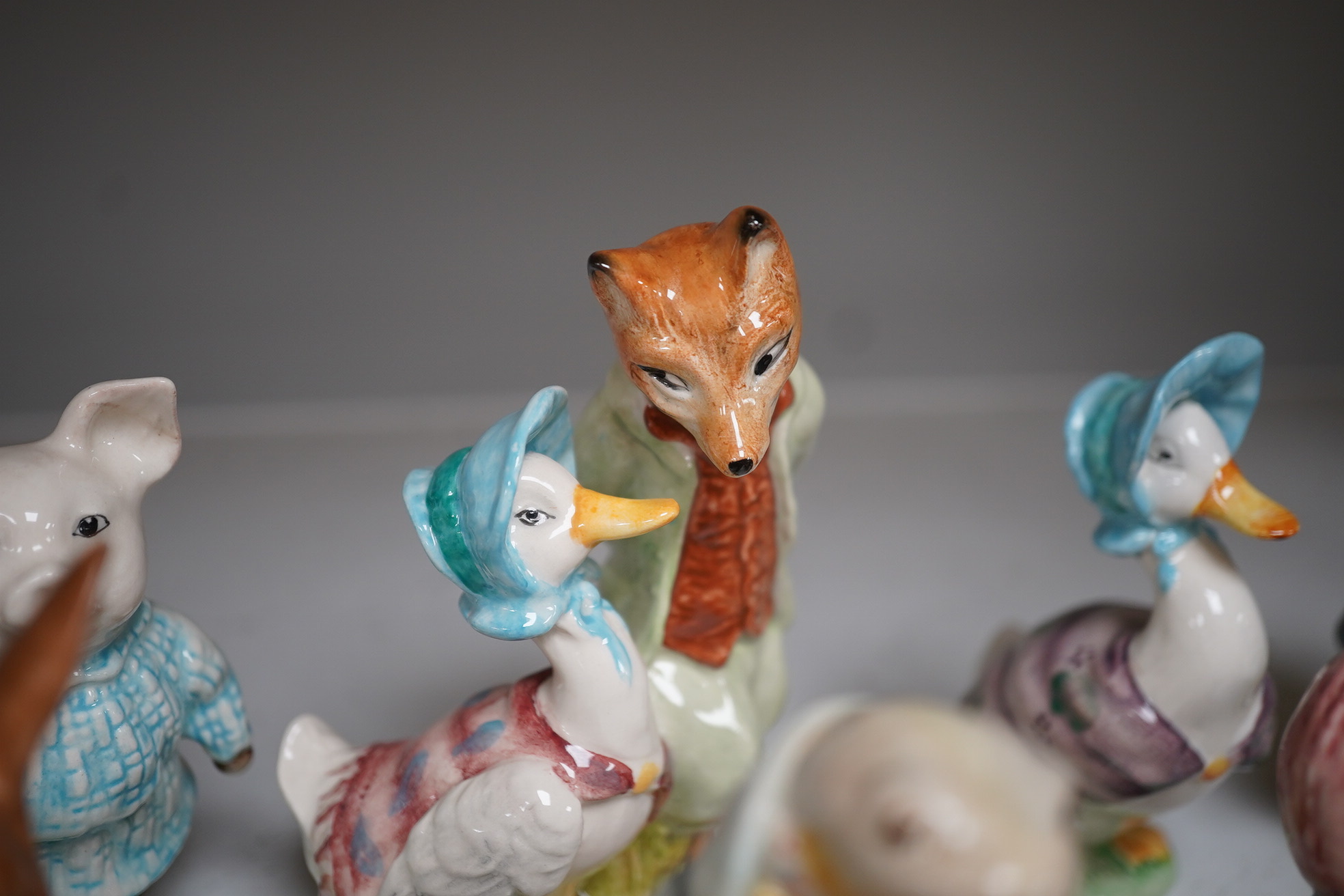 A collection of nineteen Beswick ‘Beatrix Potter’ figures, tallest Foxy Whiskered Gentleman, 12cm high. Condition - fair to good